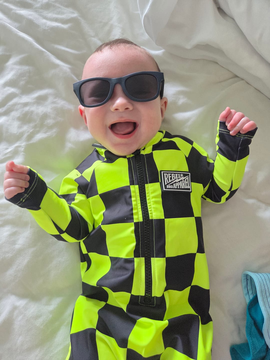 Customer photo review of UPF50+ Boys Swim Romper in Neon Electric Lime + Black Checkered