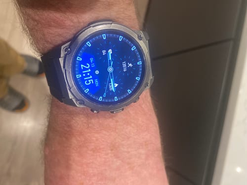 Customer's Gard Pro Ultra watch with a blue digital face displaying fitness data on their wrist.