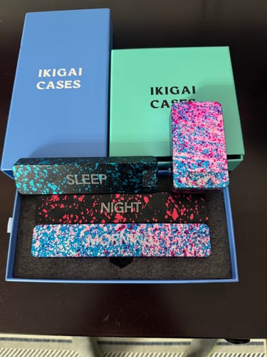 Customer's collection of four colorful Weekly AM-PM Pill Cases 2.0 displayed in their original packaging.