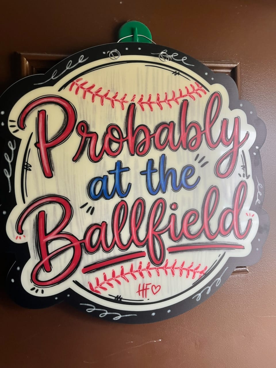 Customer photo review of Probably at the Ballfield Door Hanger