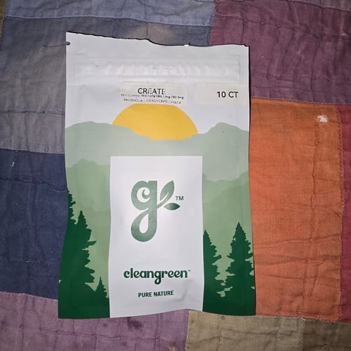 Customer's white pouch of Create Gummies resting on a colorful patchwork quilt.