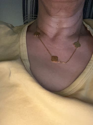 Close-up of a reviewer wearing the gold-colored Sabr, Shukr, Tawakkul Necklace against their neck.