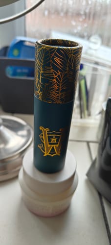 Reviewer's Kami Tonka fragrance in its decorative dark teal case with gold details.