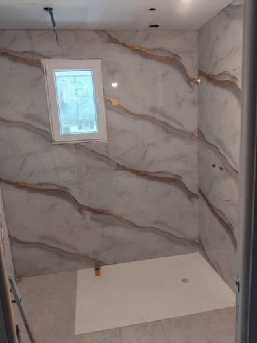 Customer photo review of Panneau Mural PVC Effet Marbre Doré – Étanche et facile à poser