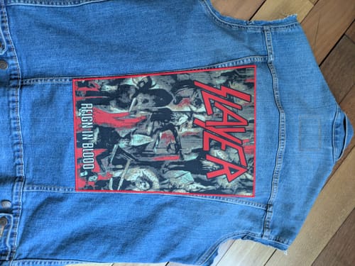 Customer's Slayer - Reign In Blood - Backpatch sewn onto the back of a blue denim vest.
