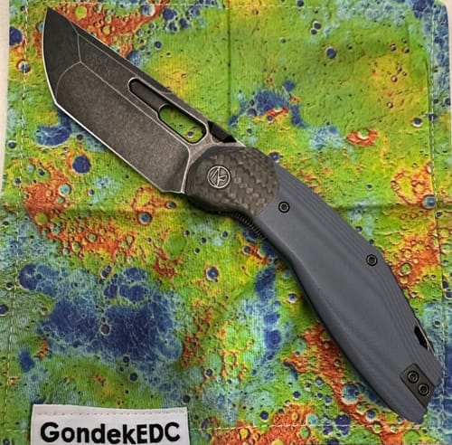 Reviewer's Ketuo Yakuza G10 knife with a stonewashed blade, carbon fiber bolster, and grey G-10 handle.