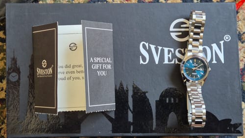 Customer's Sveston Khaki watch with a blue dial and stainless steel strap, shown on its original packaging.