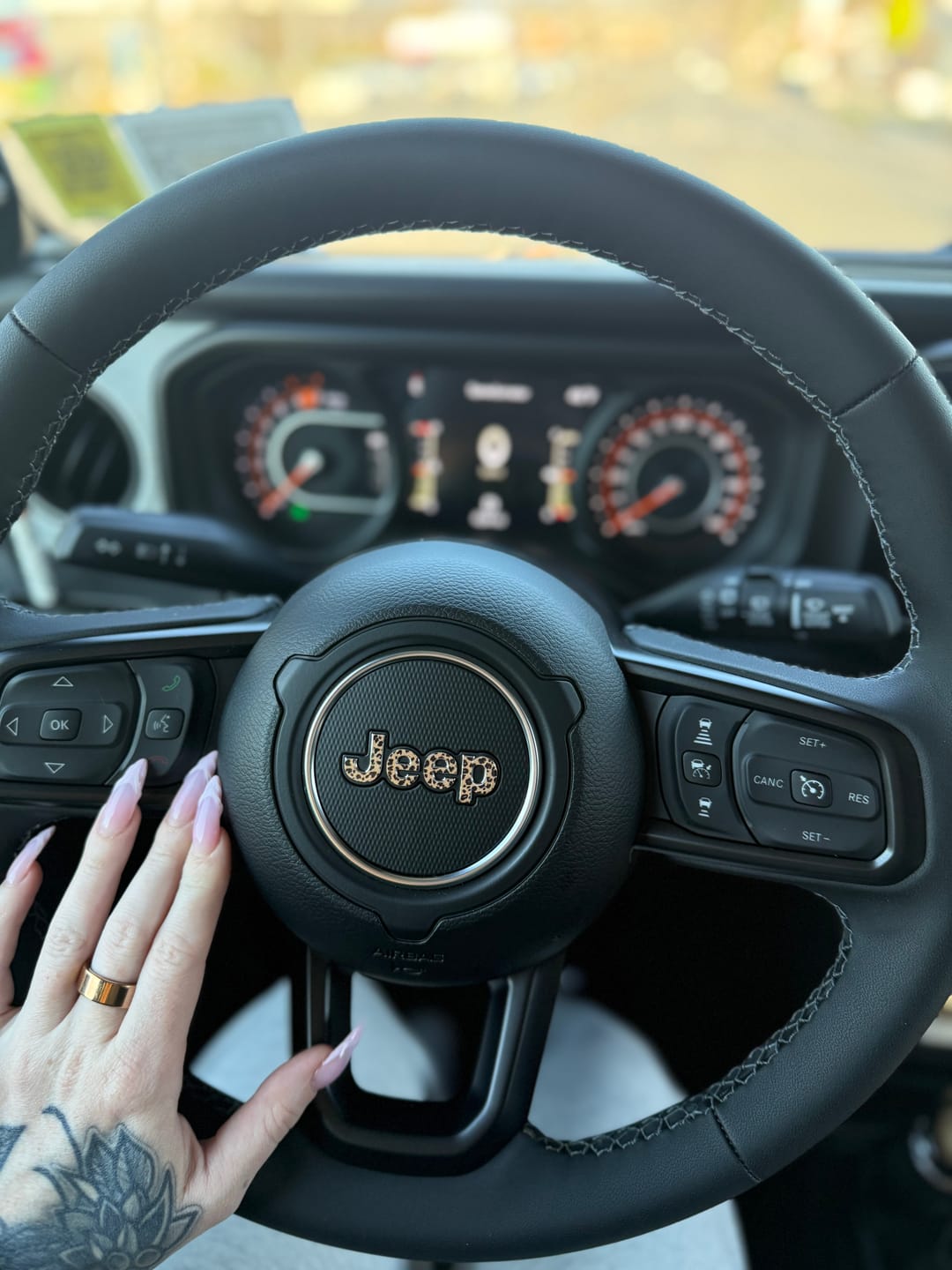 Customer photo review of JEEP Steering Wheel Emblem Overlay Decal — 30+ Colors & Designs (Flag, Topo, Animal, Solid)