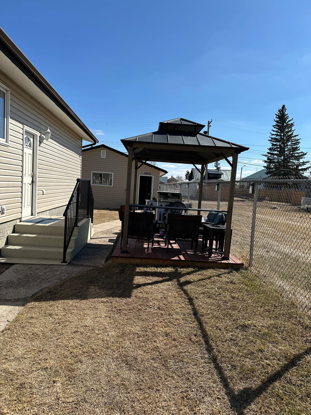 Customer photo review of SUNJOY 8x12 Wood Frame Grill Gazebo with Electrical Outlets and Shelves - Black