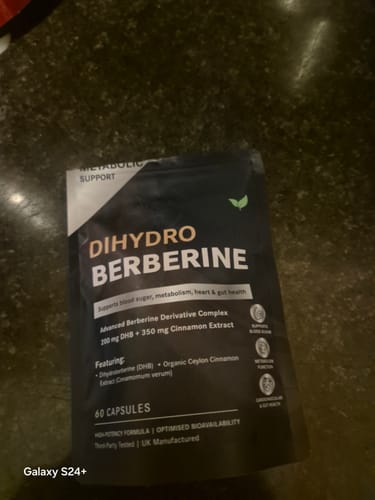Reviewer's photo showing a black pouch of Dihydro Berberine supplement, not the NMN powder.