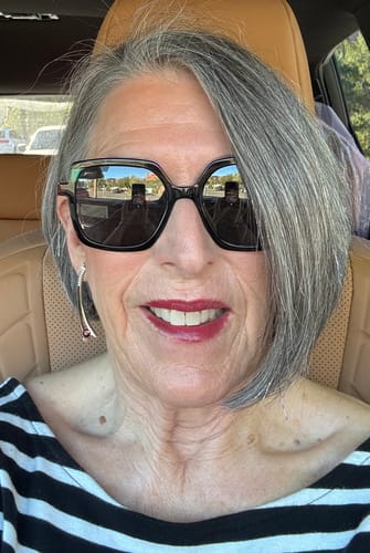 Customer showing her smiling face with smooth skin after using The Micro Infusion System.
