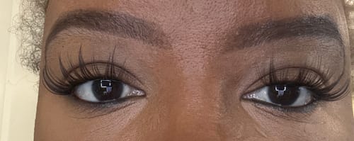 Customer's close-up view showcasing the dramatic and voluminous Manga - Brown lash clusters on their eyes.
