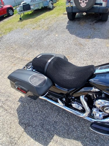 Customer's black mesh Wind Rider Seat Cover installed on their 2012 Street Glide motorcycle, parked on a gravel lot.