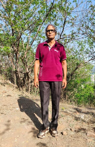 Customer standing on a dirt trail wearing the Bacca Bucci x Discovery Trek 0.1 shoes.