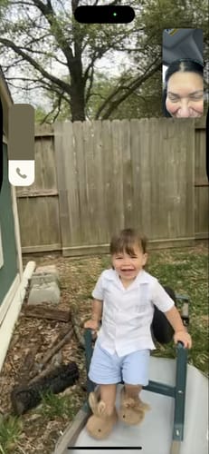 Customer's photo of a smiling toddler wearing the White Guayabera Short Set.