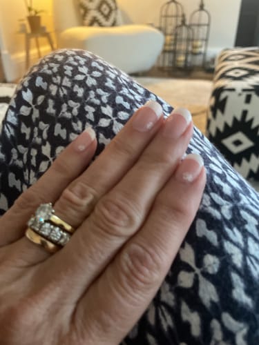 Customer's hand showing a fresh application of the Rose French Tip gel nails.