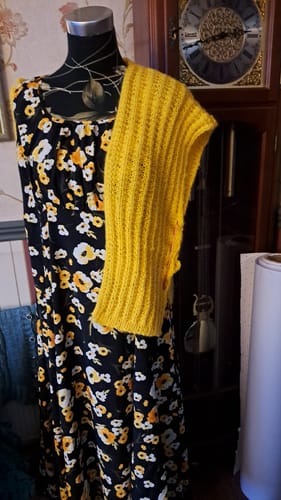 Reviewer's bright yellow knitted wool item from the Ladies Box, shown on a mannequin.