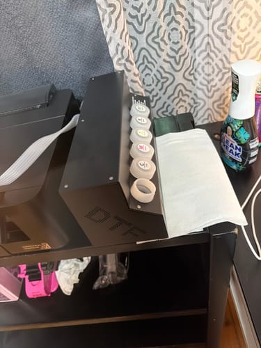 Customer's DTF CISS system from the beginner kit, partially assembled on a black desk.