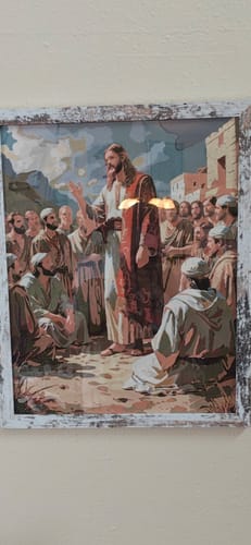 Customer's completed and framed Jesus Teaching His Disciples paint by numbers kit hanging on a wall.
