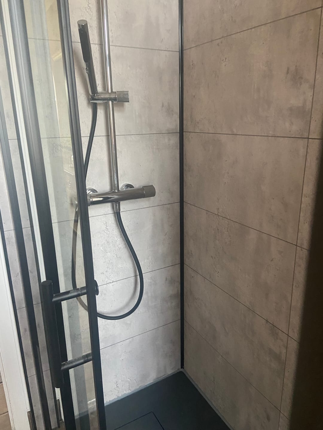 Customer photo review of Premium Grey Concrete Tile Matt Shower Wall Panel – 2.6M x 600MM