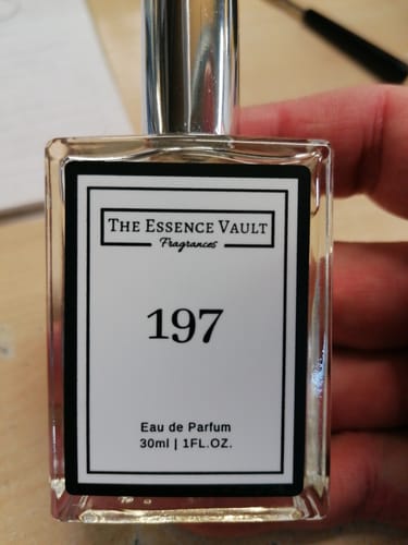 Customer holding their Mystery 30ml Perfume bottle, which shows the scent number 197 on the label.