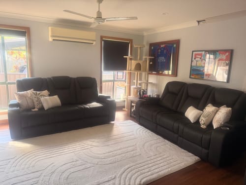 Customer's large vanilla cream Mellow Mat with a carved 3D pattern in a cozy living room.