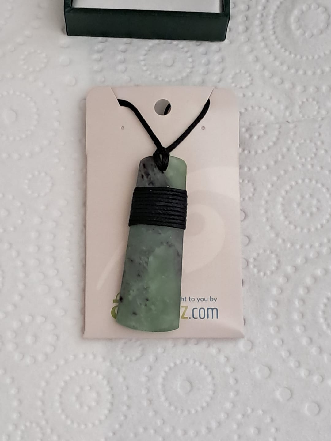 Customer photo review of Genuine Ngai Tahu Pounamu Wrapped Greenstone Toki Necklace 6cm