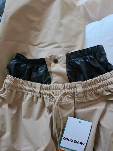 Close-up of the customer's Off White Snow Pants, showing the black inner lining and drawstring at the waistband.