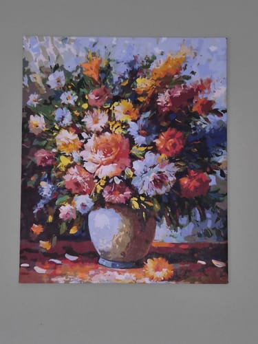 Customer's finished Spring Flowers paint by numbers, a colorful floral canvas displayed on a wall.