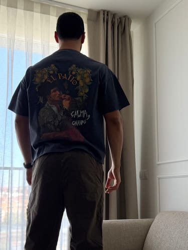Customer from behind showing the boxy fit and back graphic of the LA CAMISETA: TORERO t-shirt.