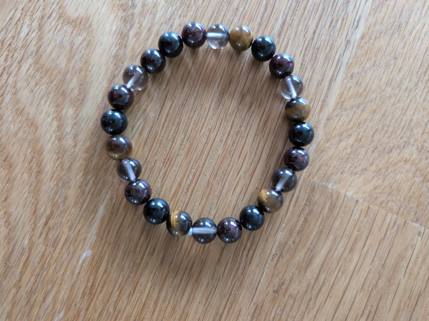 Customer photo review of Bracelet "Réussite & Protection" en Oeil de Tigre, Grenat, Tourmaline & Quartz Fumé