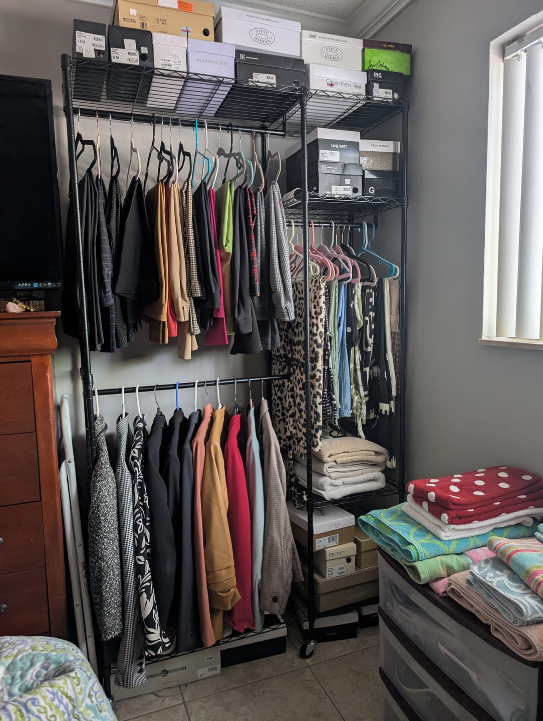 Customer photo review of Raybee Heavy Duty Portable Clothes Rack With Wheels,Clothing Rack For Hanging,Garment Rack For Bedroom