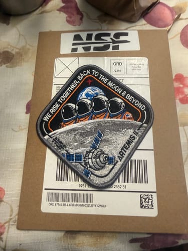 Customer's detailed Artemis II - Collectors Patch resting on the cardboard mailer it arrived in.