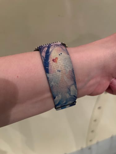 Customer wearing the Follow Your Heart Ghost Watch Band on their wrist, featuring a cute ghost with a small red heart.