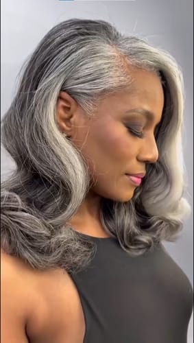 Customer photo review of Luvwin Silver Grey Salt & Pepper Wavy Wig With Signature White Front Streaks