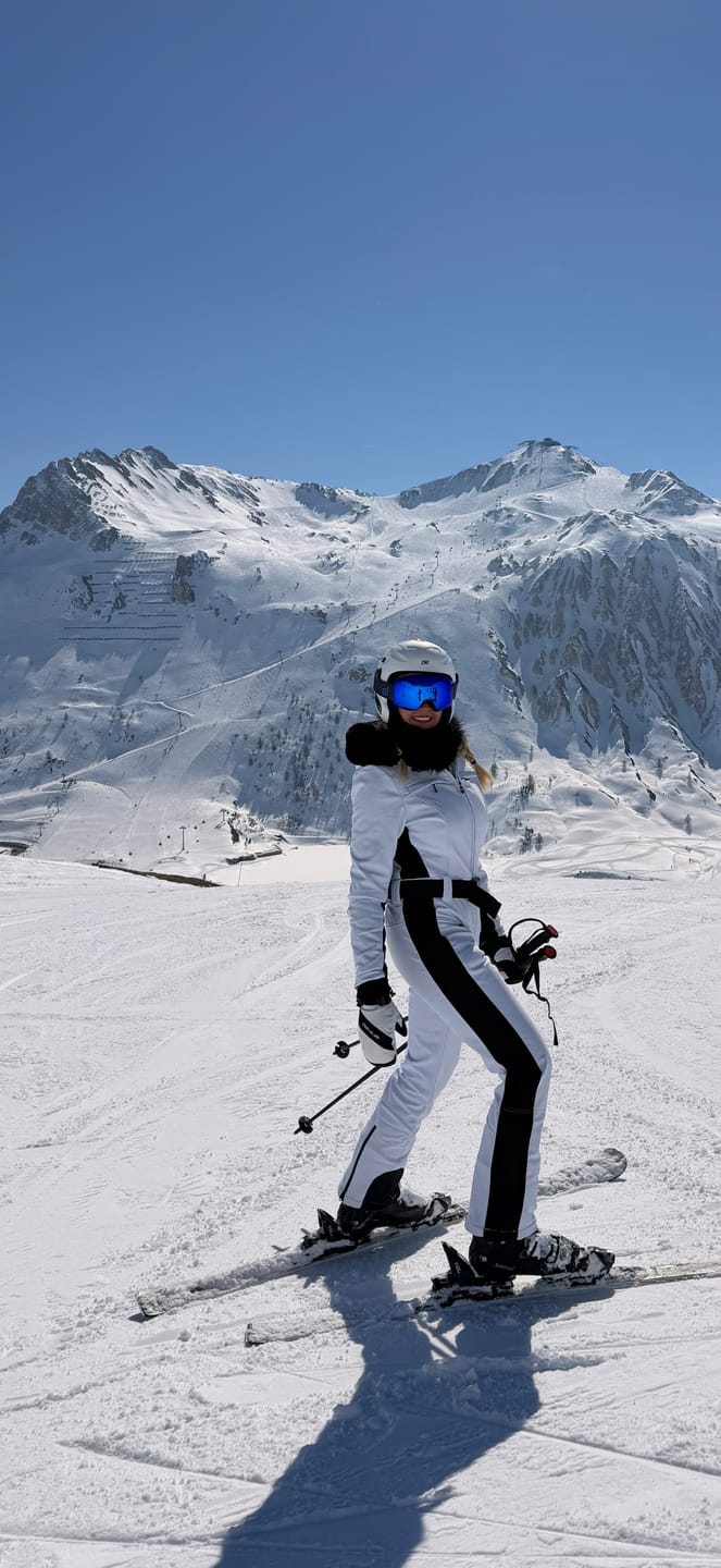Customer photo review of Women's Minimalist Faux Fur White & Black Down One-piece Ski Suits