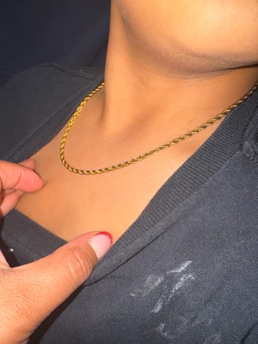 Reviewer's close-up photo of the Free Calla Gold Twisted Chain Necklace on a person's neck.