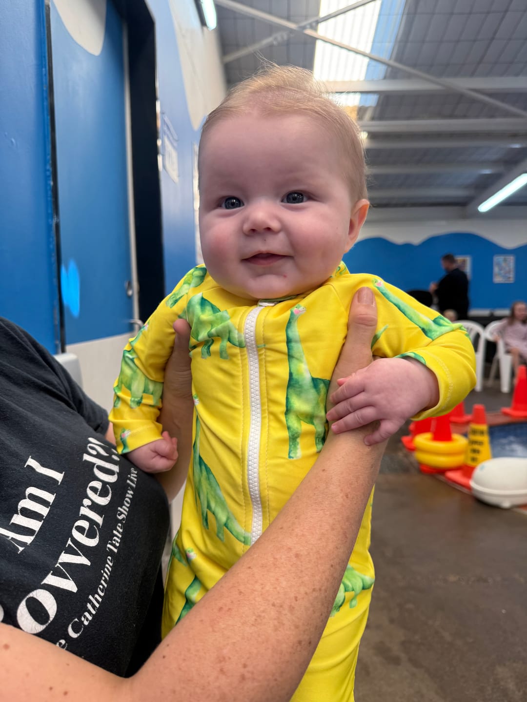 Customer photo review of Fluro Dinosaurs Unisex Long Sleeve Zip Swimmers
