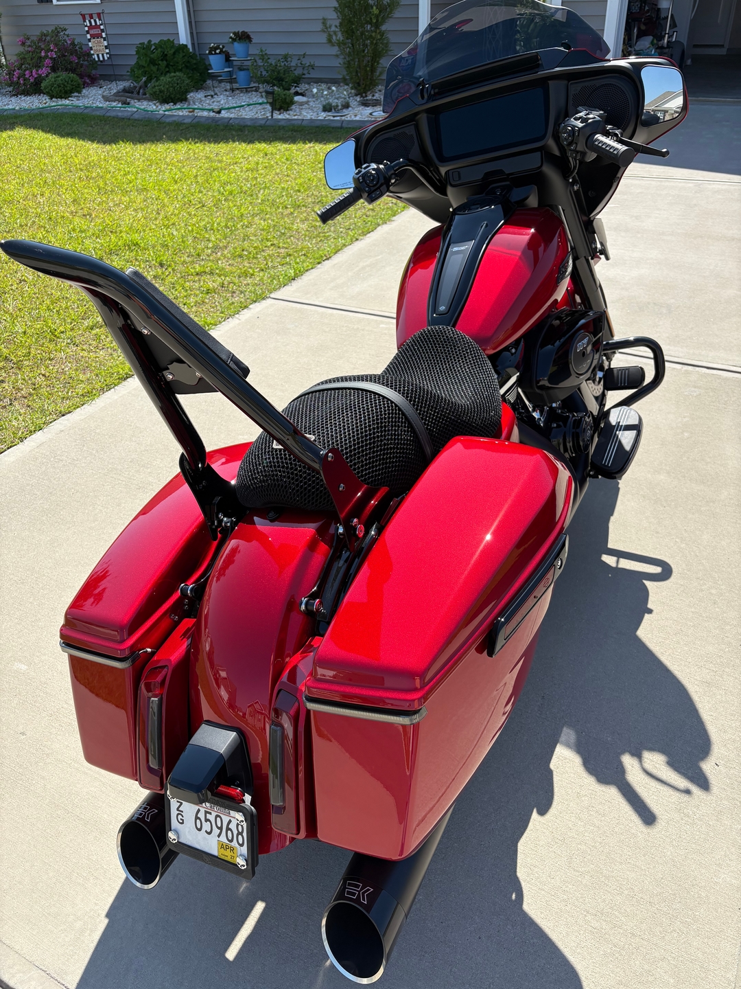 Harley bagger with breathable 3D mesh seat cover installed in shaded garage showing airflow solution