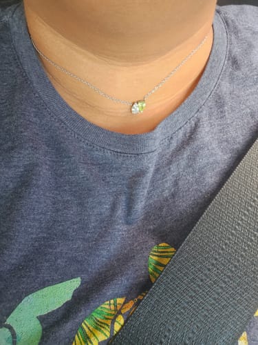 Customer wearing the Elara Birthstone Necklace, showing its short chain with two delicate stones.