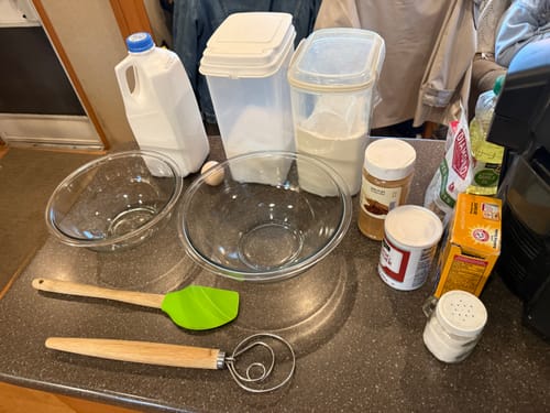 Customer image showing various baking ingredients laid out on a kitchen counter.