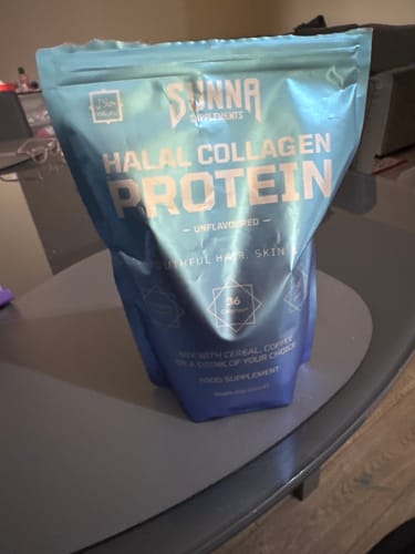 Reviewer's blue pouch of Halal Collagen Protein supplement sitting on a table.