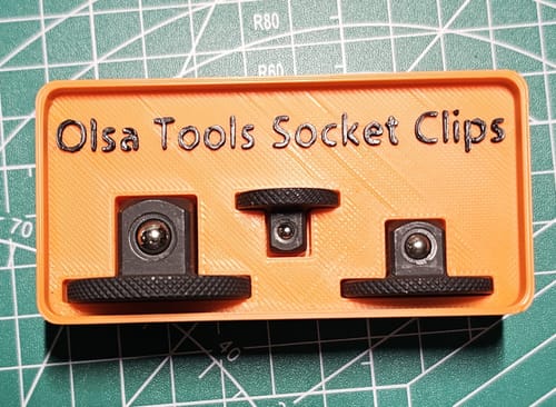 Customer's custom-made orange holder showing three black bits from the Stubby Impact Bit Set.