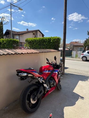 Reviewer's red Honda CBR600RR parked outdoors, showing the clean look of the installed tail tidy.