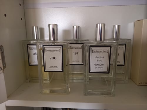 Customer's collection of fragrances on a shelf, with the 'Inspired by Aventus - 200' bottle in the foreground.