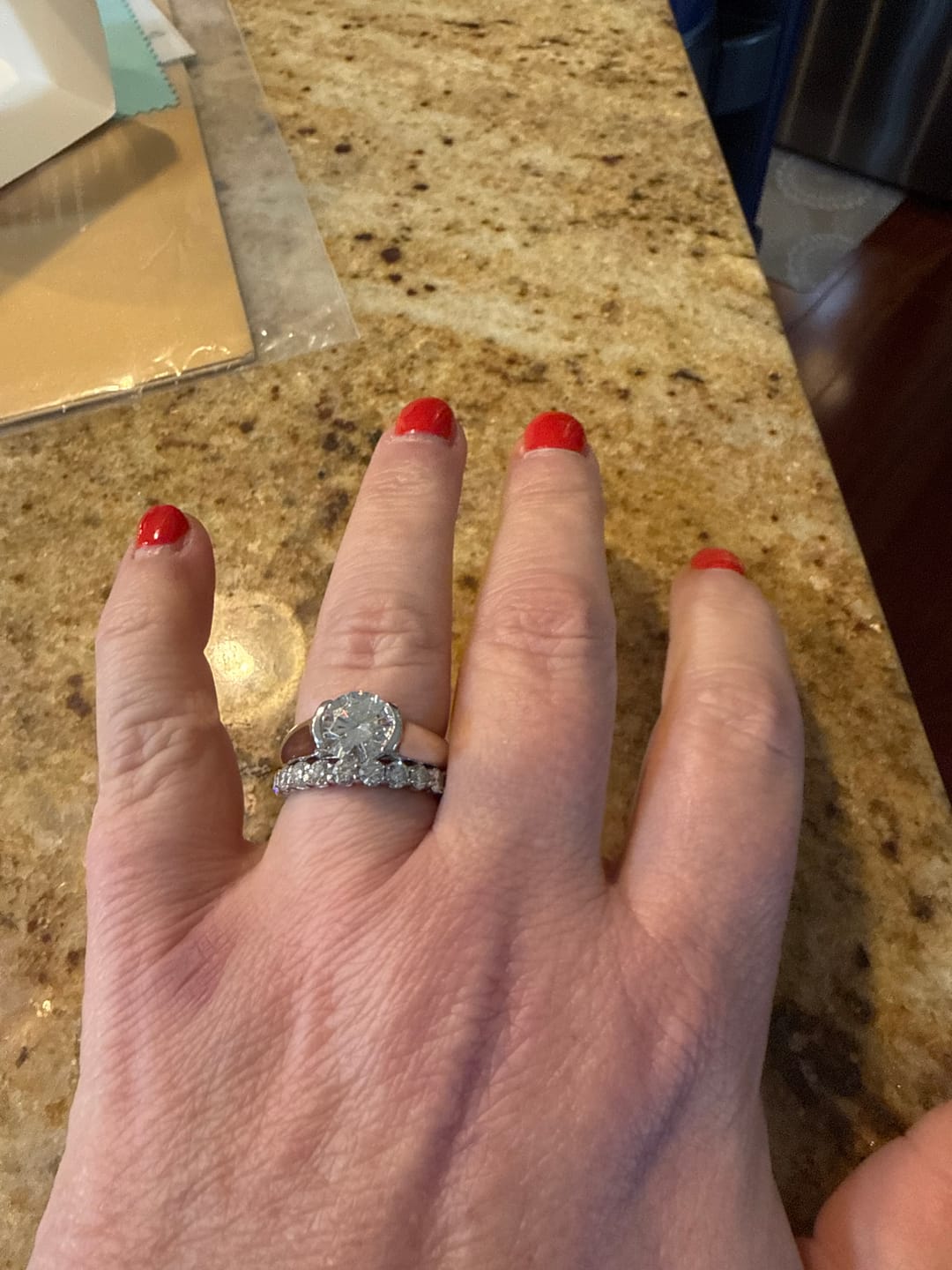 Customer photo review of Solitaire Moissanite Half Bezel Set Sterling Silver Engagement Ring