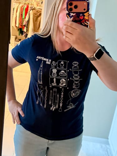 Reviewer wearing the navy SLS Assembly Instructions T-shirt, showing the fit and detailed graphic.