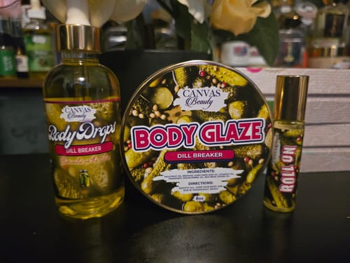 Reviewer's Dill Breaker Discovery Set, showing the Body Drops, Body Glaze, and Roll-On arranged on a table.