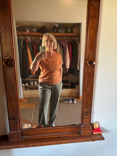Customer takes a mirror selfie showing the full-length, relaxed fit of the sage olive Palmer Joggers.