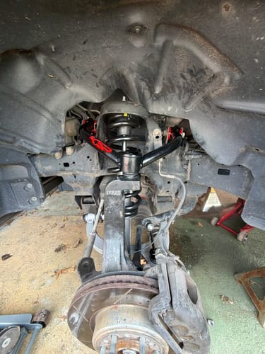 Customer's new black Upper Control Arm Suspension Kit installed on their truck's suspension.